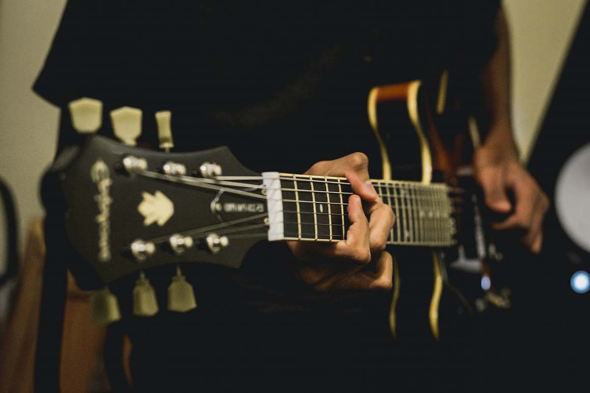 electric guitar person playing electric guitar guitar